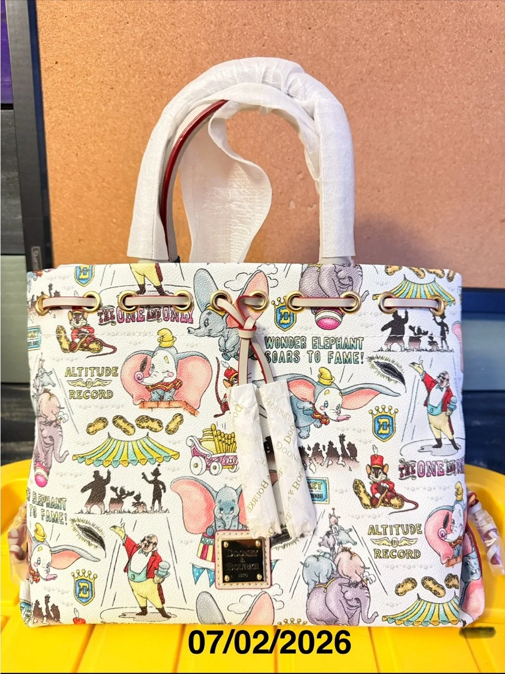 Disney Dooney and Bourke Dunbo Printed Satchel in White, Pink and Gold Accents